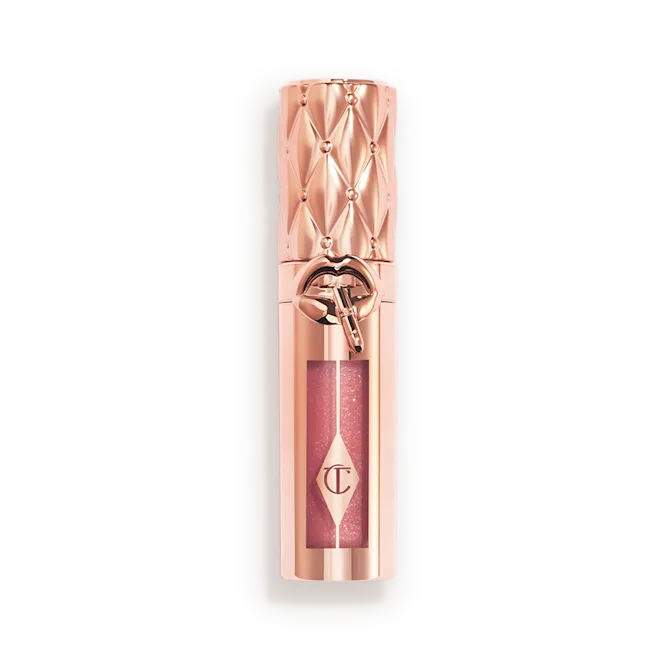 Charlotte Tilbury Big Lip Plumpgasm lip gloss in metallic rose gold packaging with pink shimmer, luxury makeup available at Darling Lux.