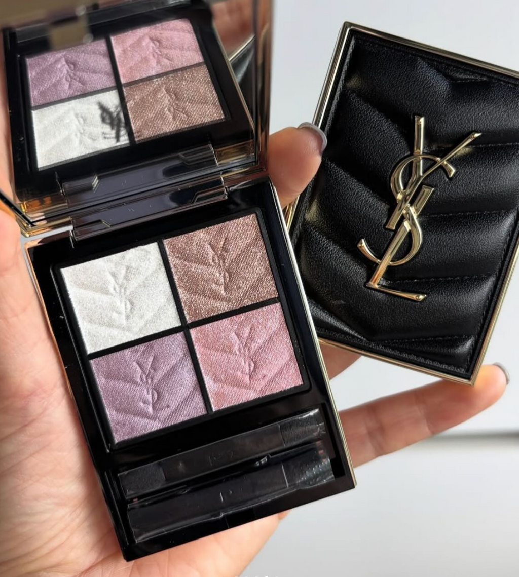 Makeup palette with YSL logo on a neutral background