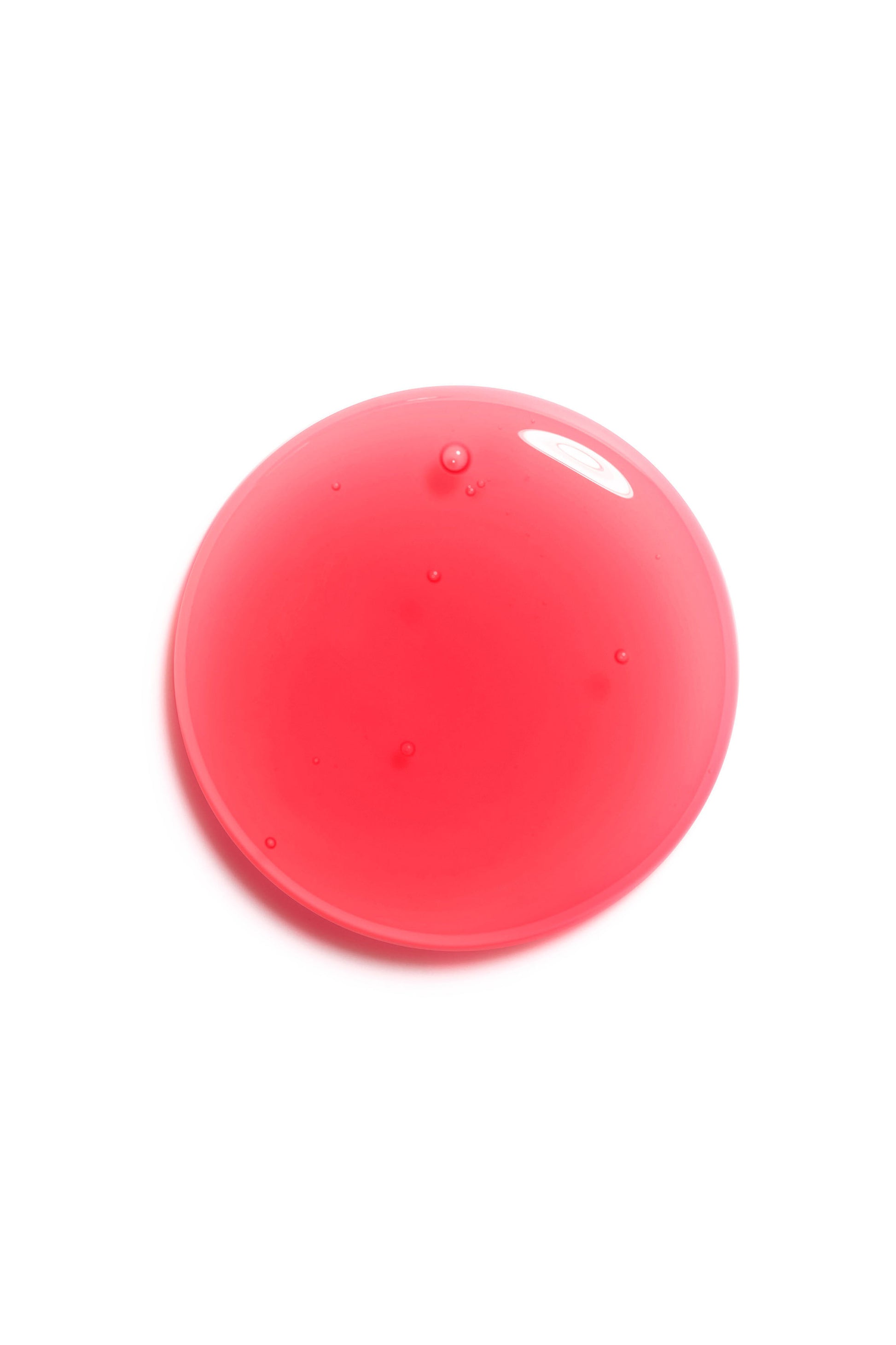 Red spherical object on a white background Addict Glow Oil cherry 015