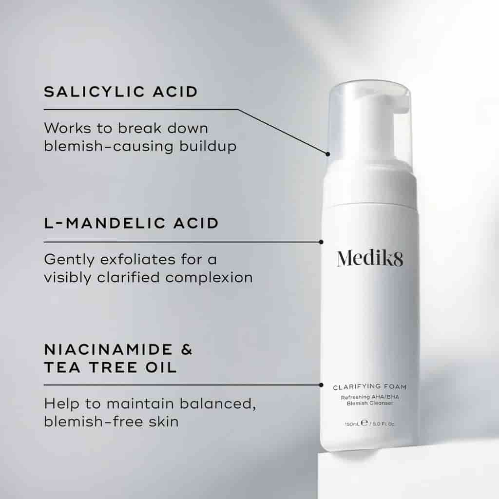 Medik8 clarifying foam bottle with text on salicylic acid, L-mandelic acid, and niacinamide & tea tree oil benefits.