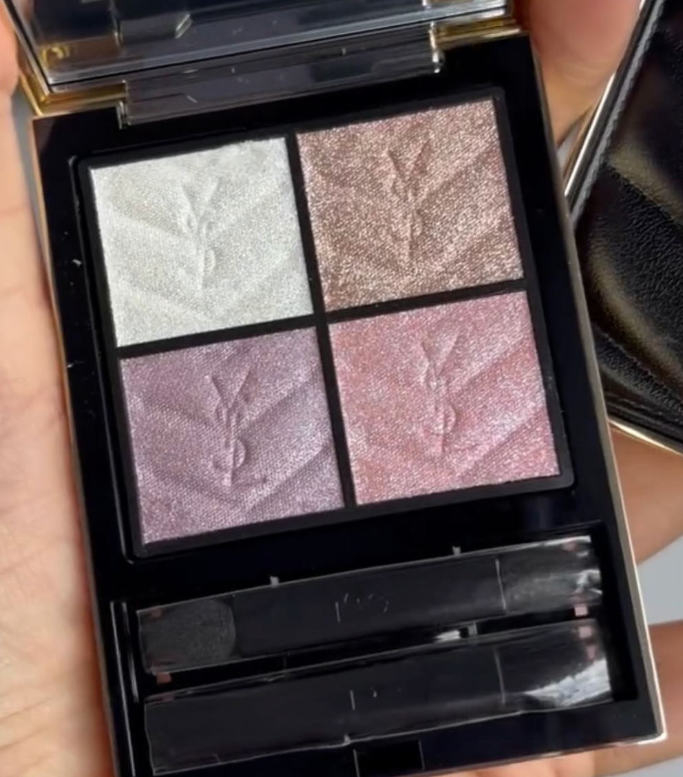 Makeup palette with four colors and a brush, YSL logo visible