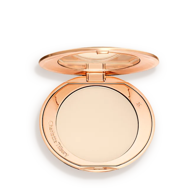 Rose gold compact powder case on a white background