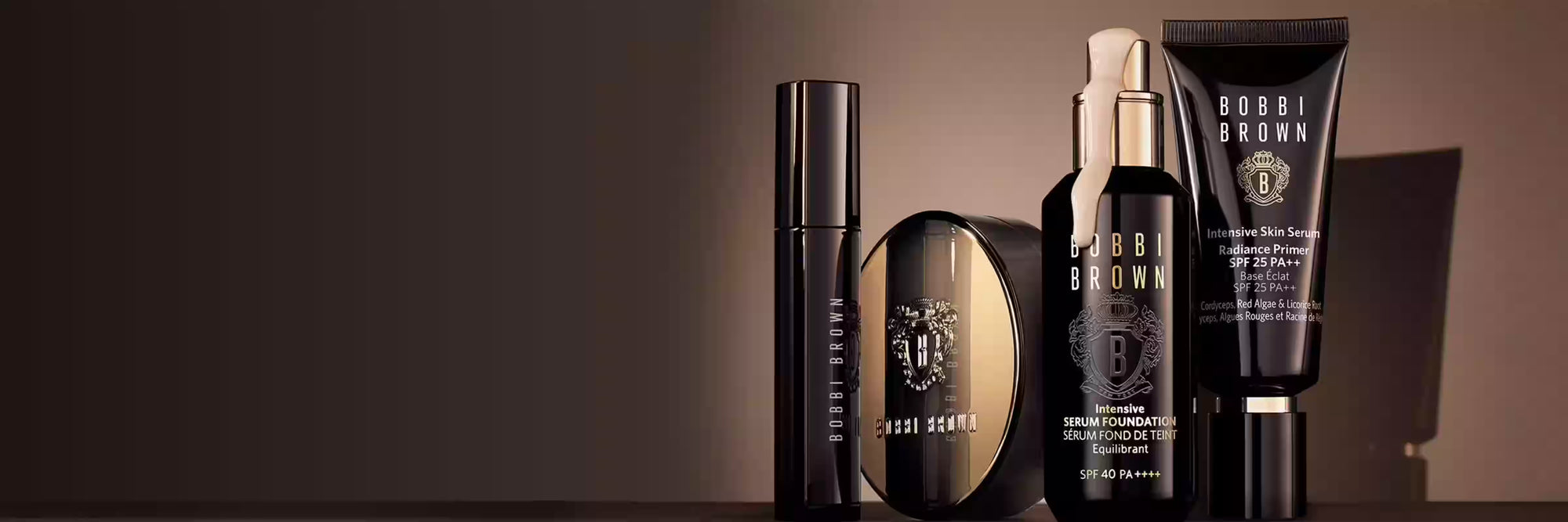 Collection of Bobbi Brown skincare products on a dark background