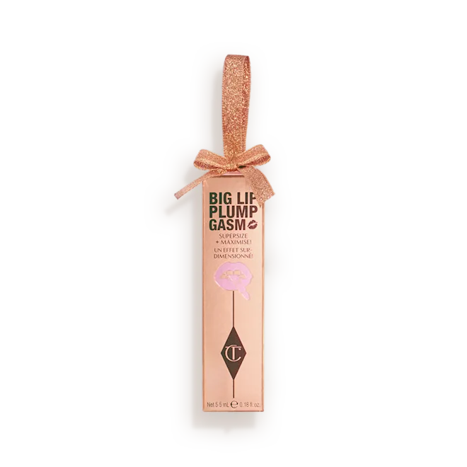 Charlotte Tilbury Big Lip Plumpgasm lip gloss in elegant rose gold gift packaging with a ribbon bow, available at Darling Lux.