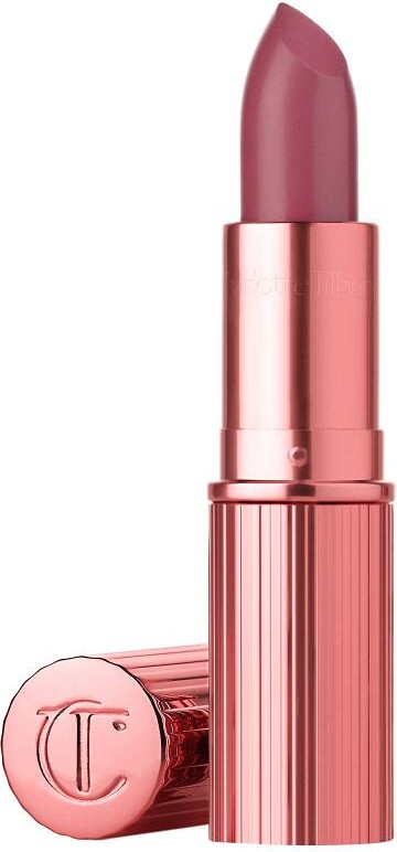 Pink lipstick with a metallic cap on a white background