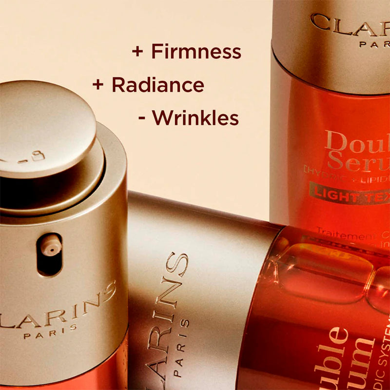 Close-up of Clarins Double Serum Light Texture bottles with text listing benefits: increased firmness, increased radiance, and reduced wrinkles.