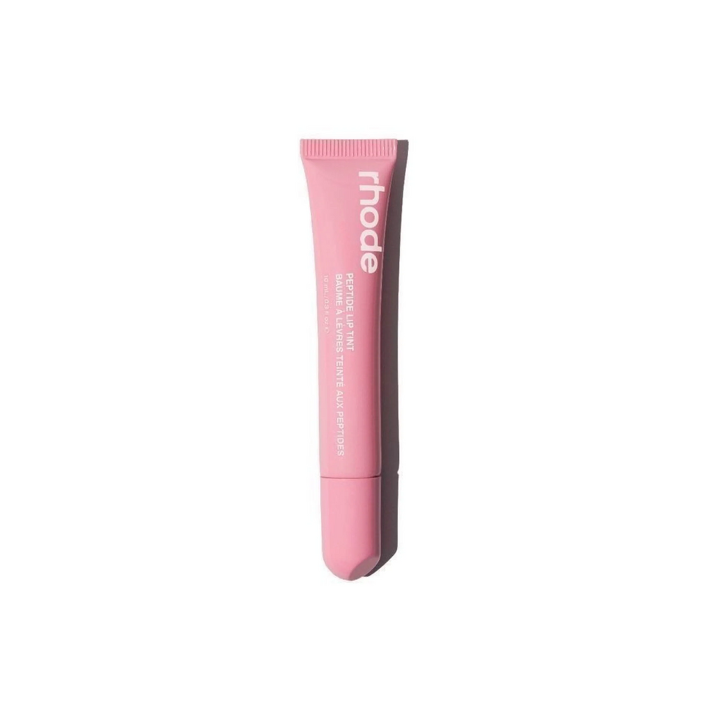Pink lip balm tube with 'rhode' branding on a white background