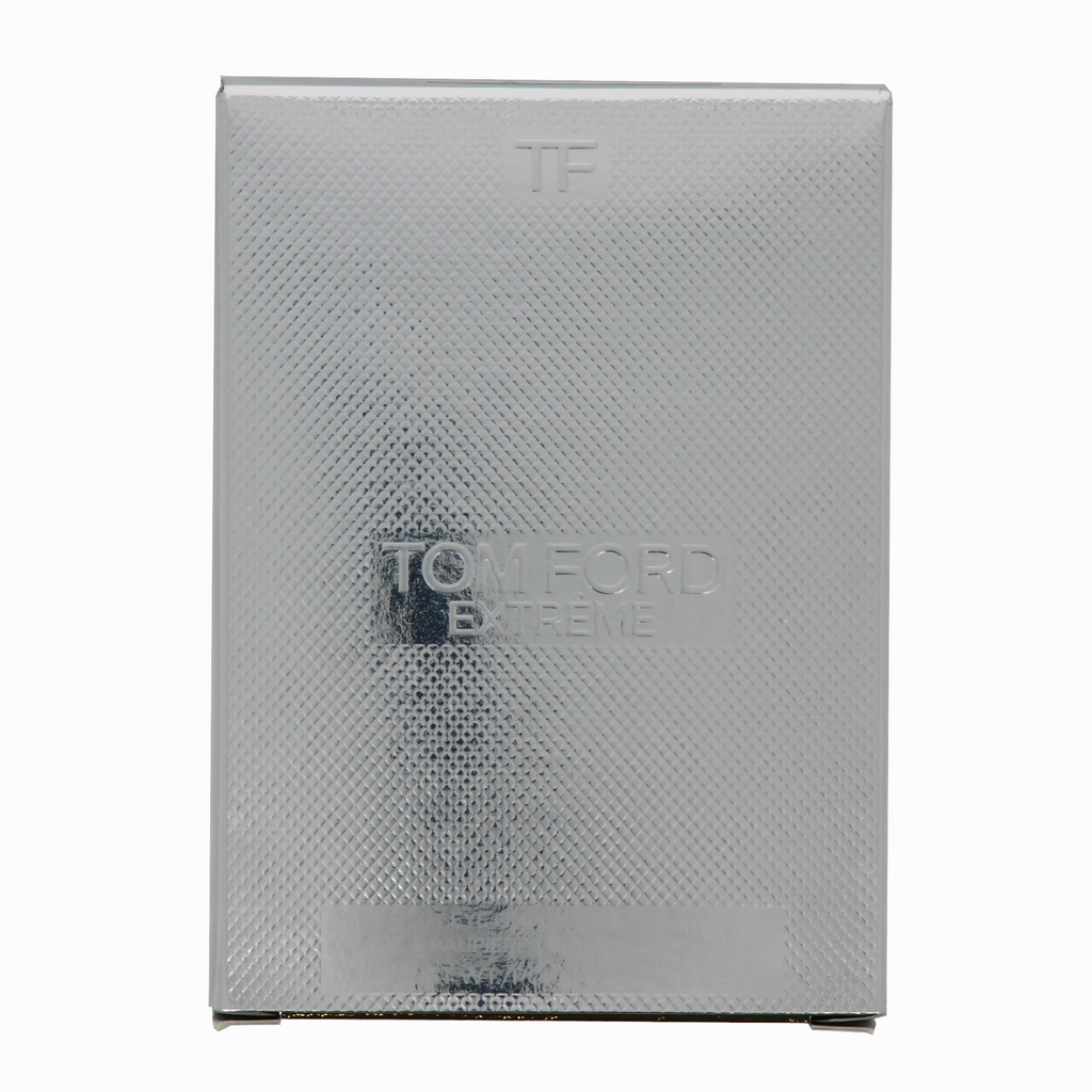 Silver textured box with 'Tom Ford Extreme' branding on a white background