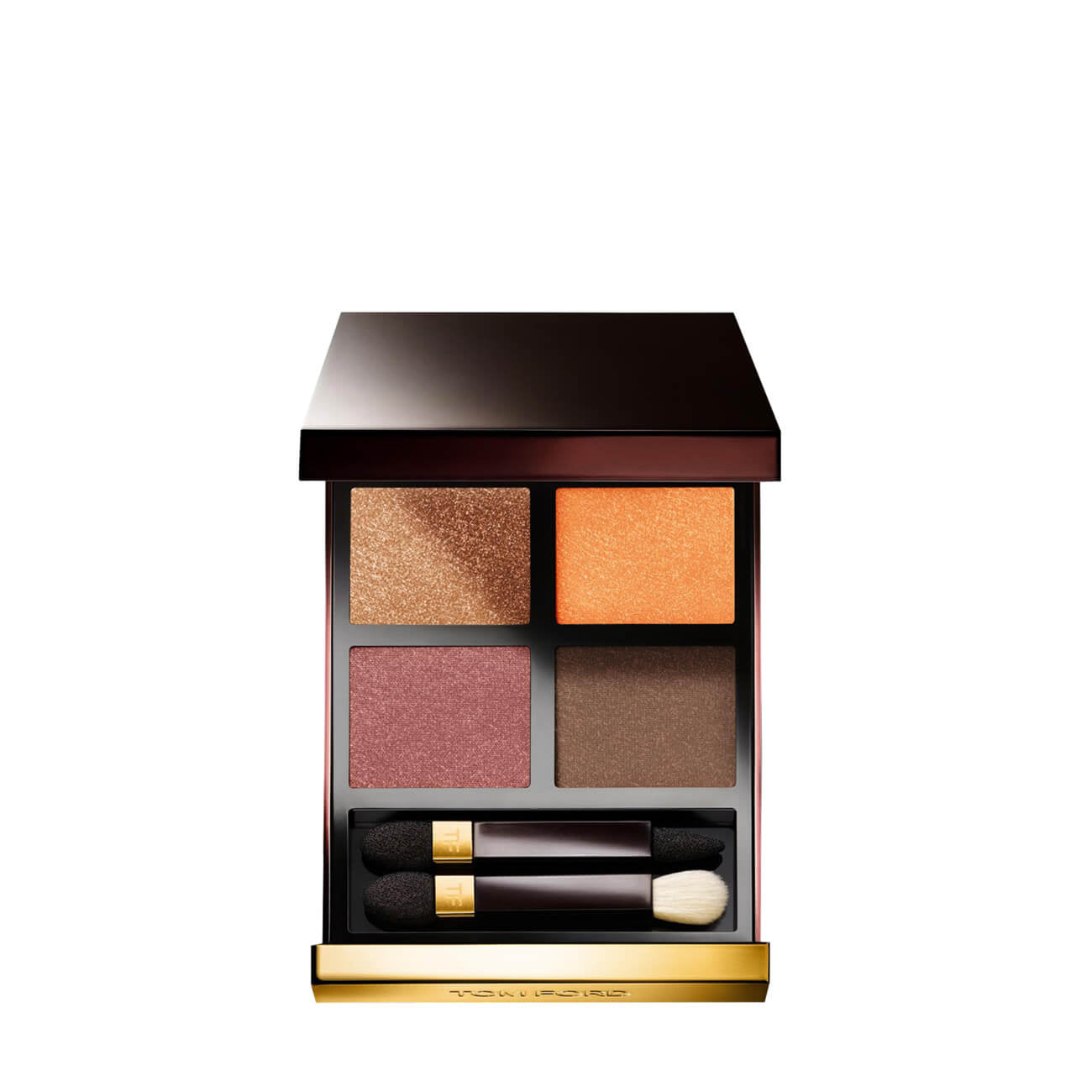 Tom Ford makeup palette with four colors and a brush on a white background